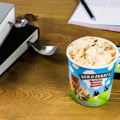 Pint of Half Baked with a bowl full and someone reading a book